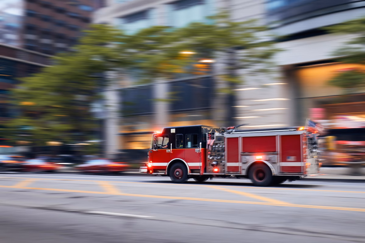fire truck driving through city